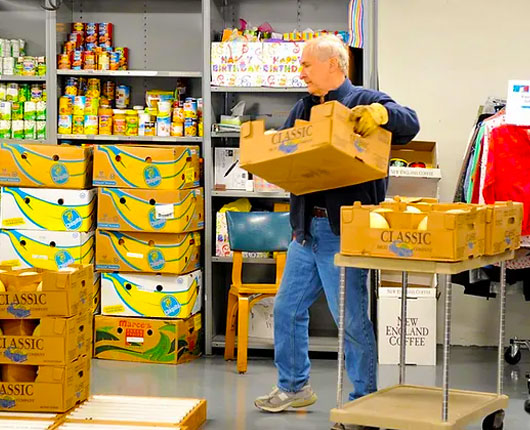 man-volunteering-food-bank